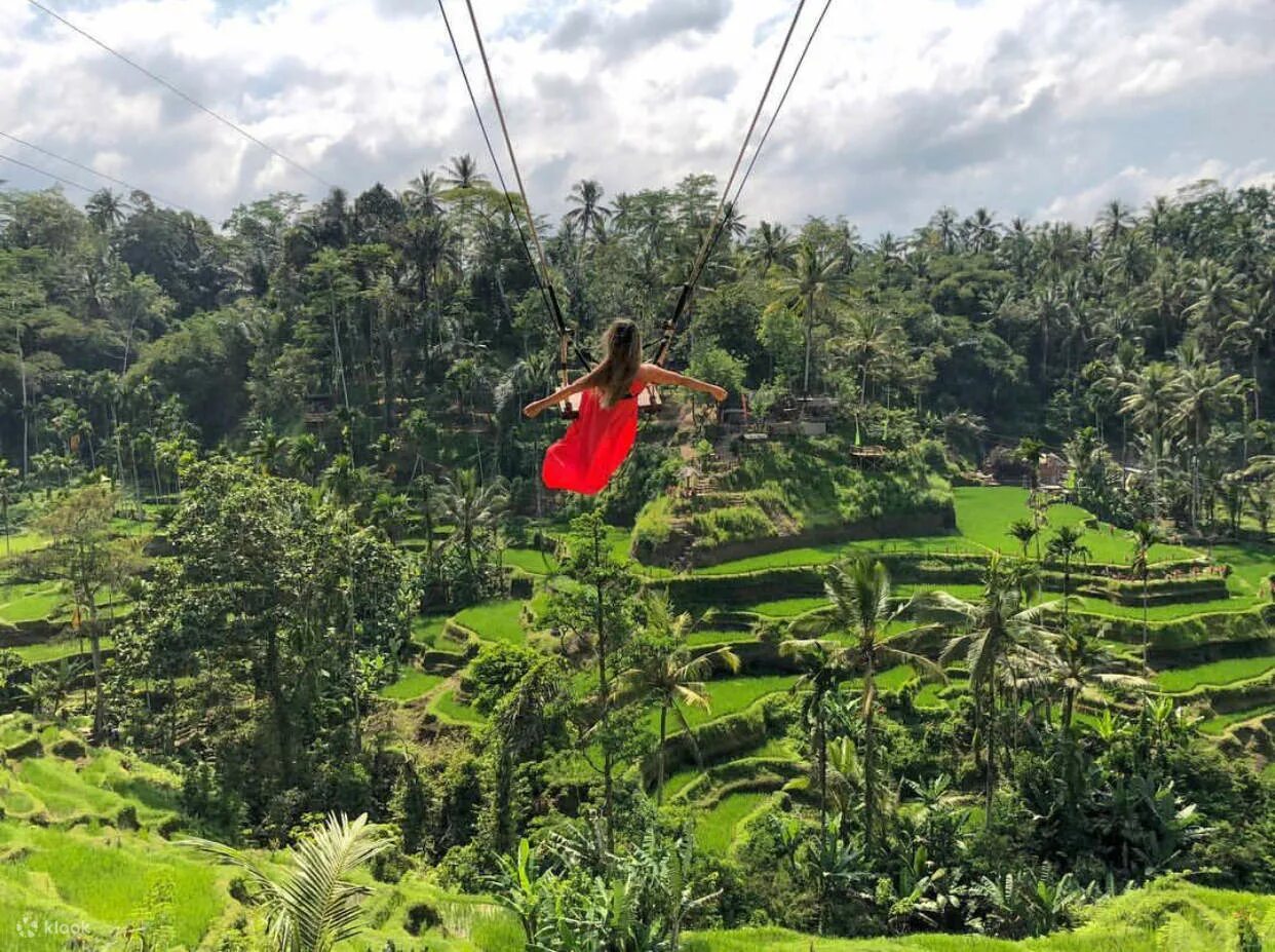 Bali sports and community — swimming and football at sunset